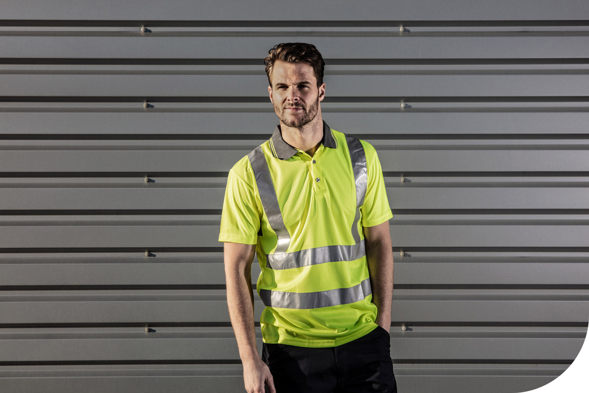 Man wearing hi-vis ROKWEAR polo shirt.