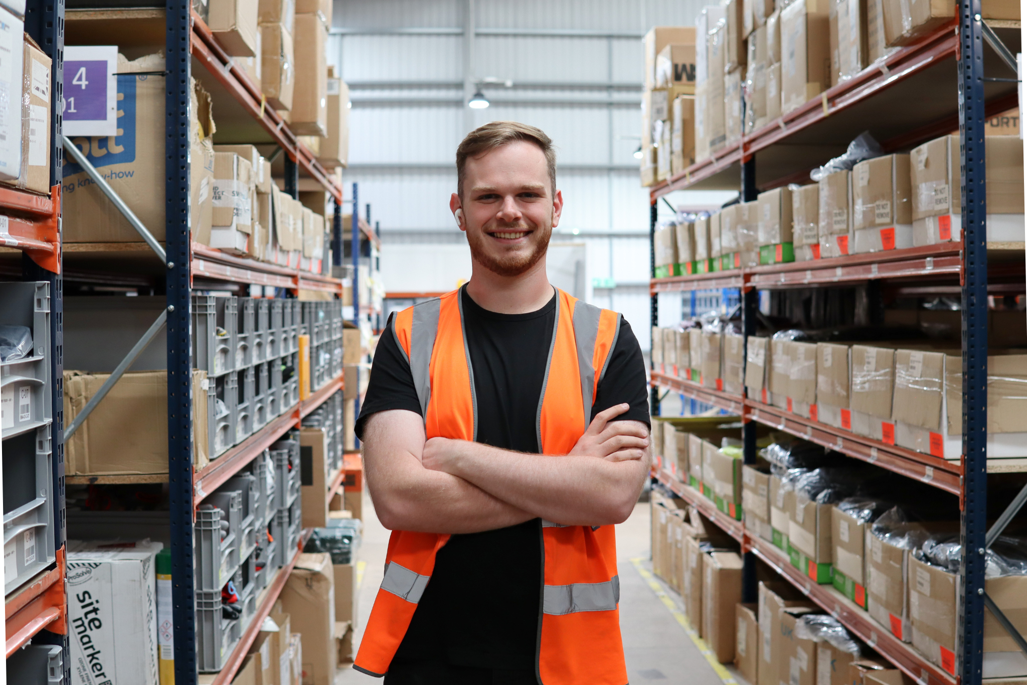 Man in hi-vis in a warehouse