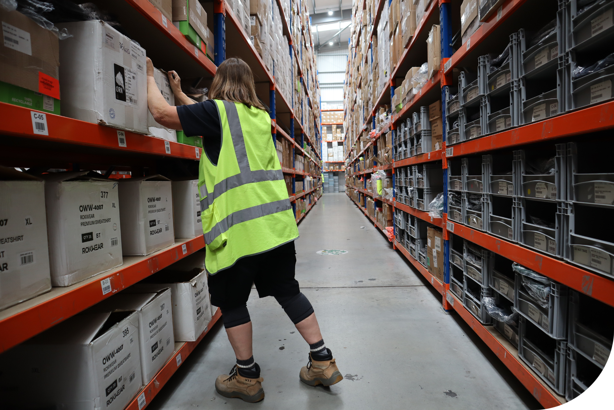 Woman wearing hi-vis in a warehouse