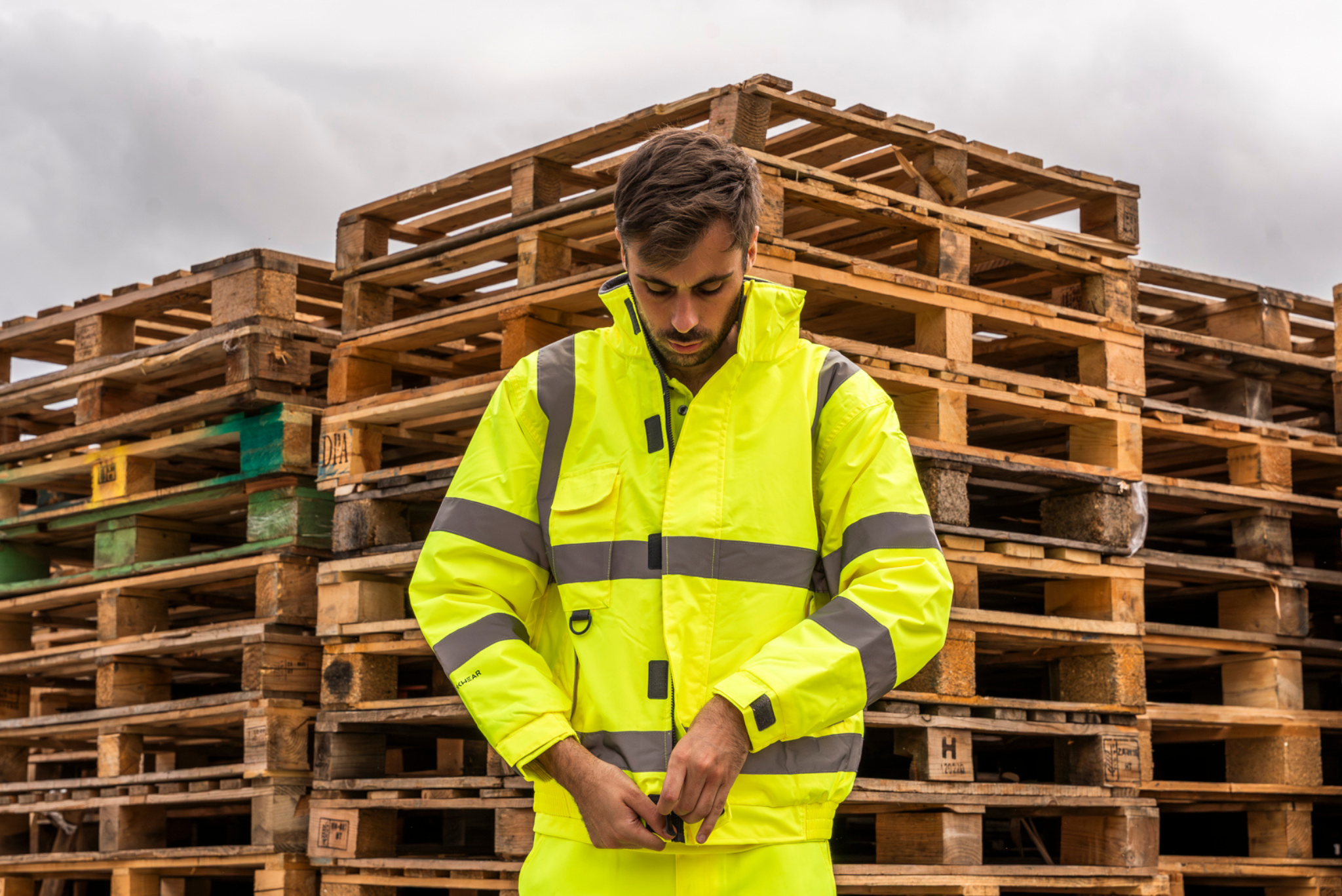 Man in yellow hi-vis workwear.